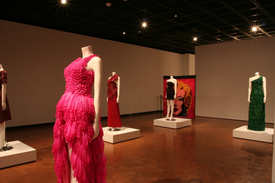 Adriana Bertini’s Condom Couture garments under dramatic lighting