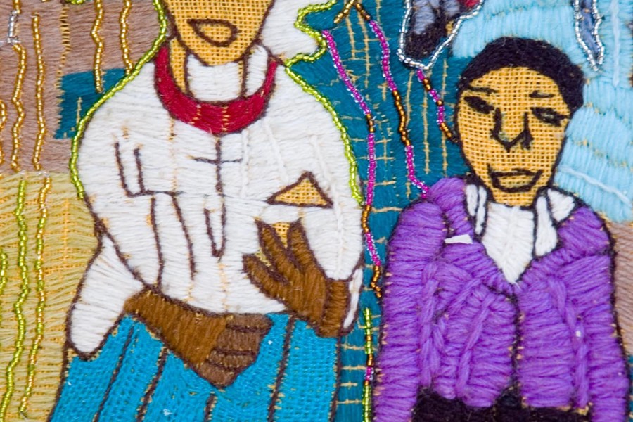Close-up of embroidered church uniforms in the second layer of the Keiskamma Altarpiece