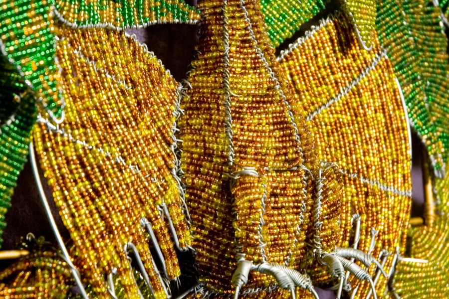 Wire beadwork depicting local animals and a flower in the third layer of the Keiskamma Altarpiece