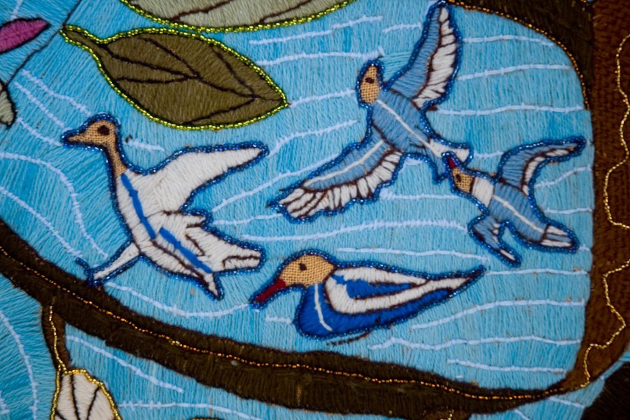 Embroidered birds among coastal fig branches in the second layer of the Keiskamma Altarpiece