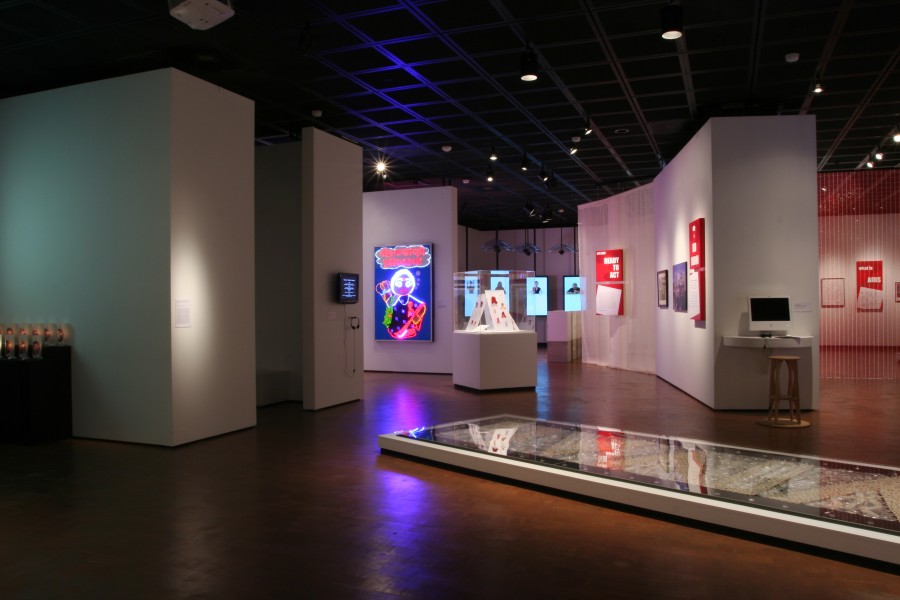 Wide gallery view of works displayed across multiple exhibition sections