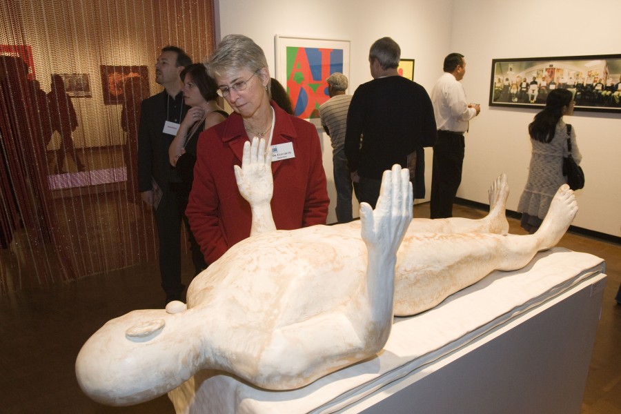 Clive van den Berg’s sculpture *Love’s Ballast*, with a carved figure and soft black form, displayed in the exhibition