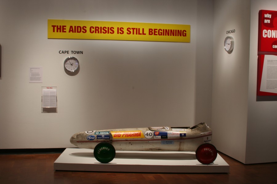 Gregg Bordowitz’s mixed-media installation *Drive*, centered on a racing car as a metaphor for access to HIV treatment