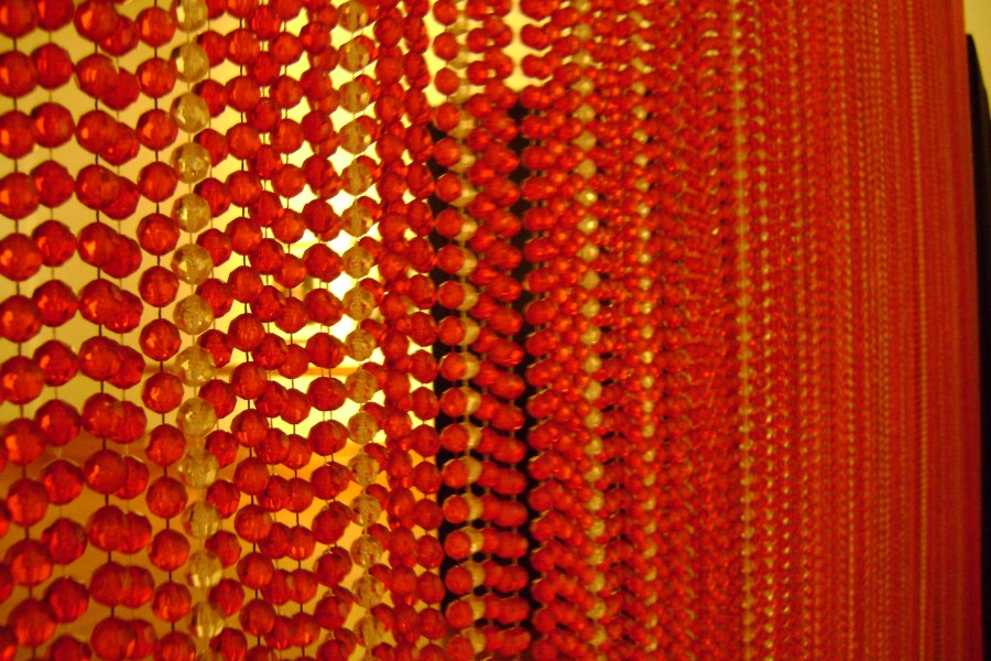 Red Beaded Curtain in Not Alone