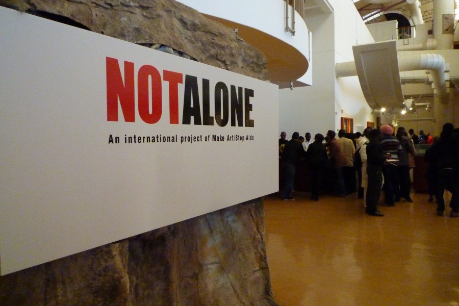 Exhibition title for *Not Alone: An International Project of MAKE ART/STOP AIDS*