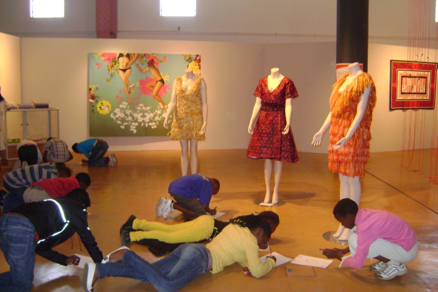 Visitors Writing in the Not Alone Exhibit in South Africa