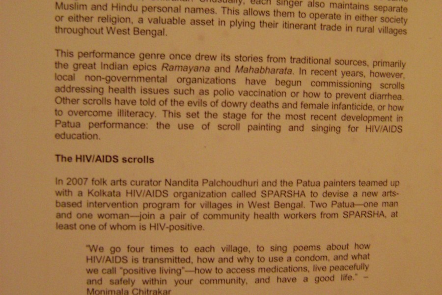 Wall text titled “HIV/AIDS Scrolls of West Bengal”