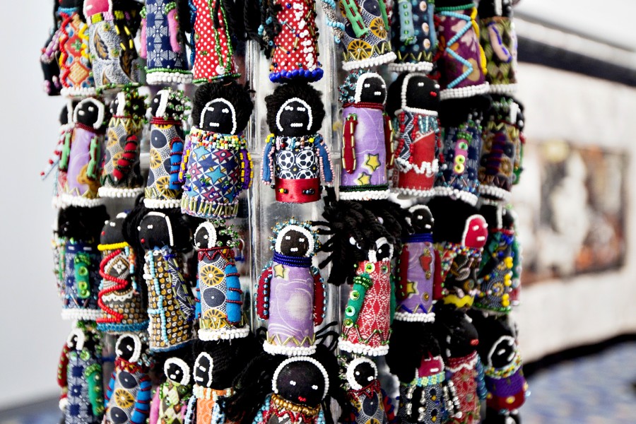 Close-up of beaded cloth dolls in Human Orphan Tower