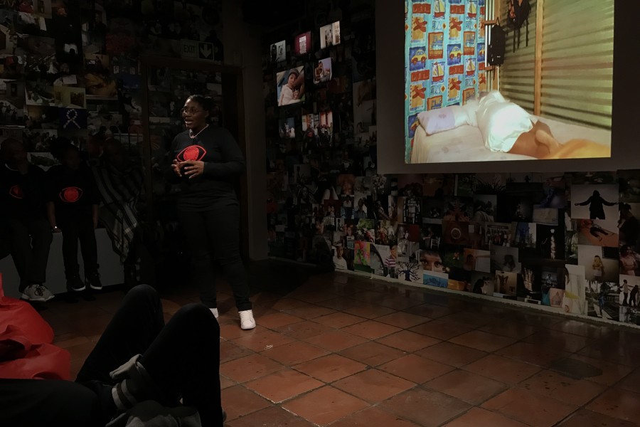 A Through Positive Eyes artivist sharing a personal story during live storytelling
