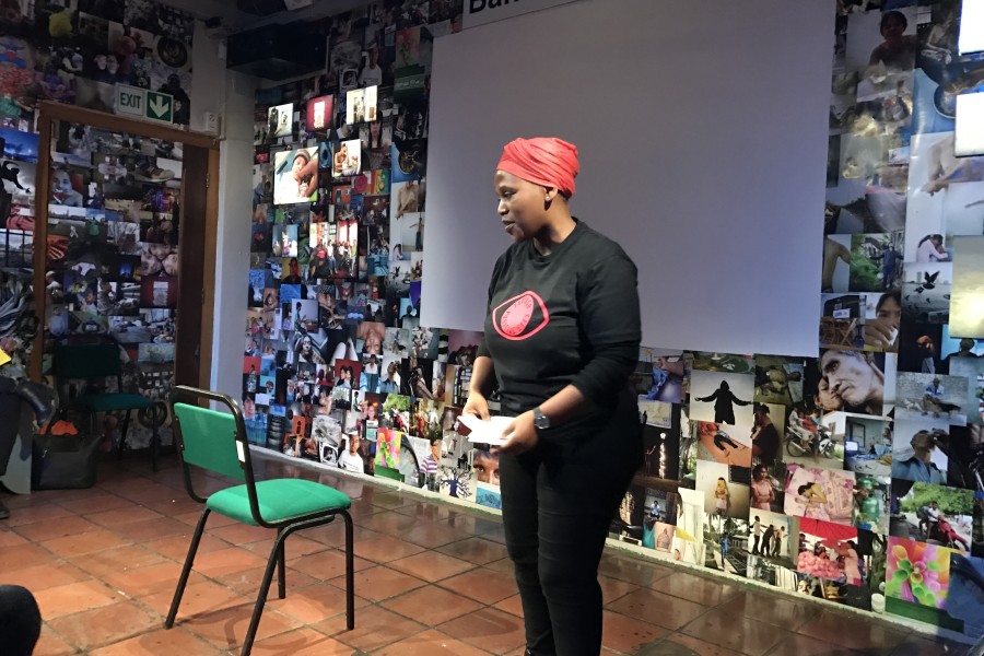 A Through Positive Eyes artivist sharing a personal story during live storytelling