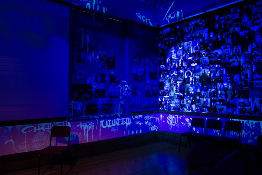 Graffiti-like phrases about HIV stigma revealed by blacklight in the Banishing Stigma Room