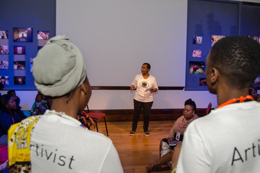An artivist performing in the Banishing Stigma Room