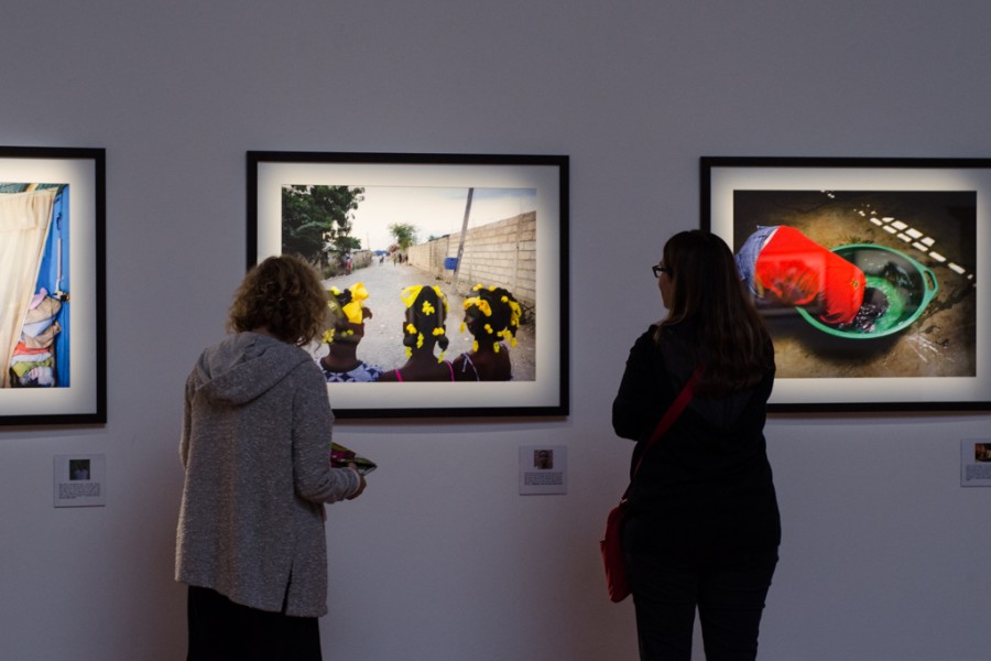 Visitors viewing photographs in the My Photo. My Story. section during the exhibition opening