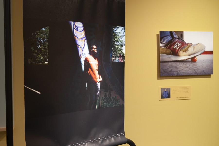 Photograph by D'Angelo displayed above an iPad playing a video about D'Angelo