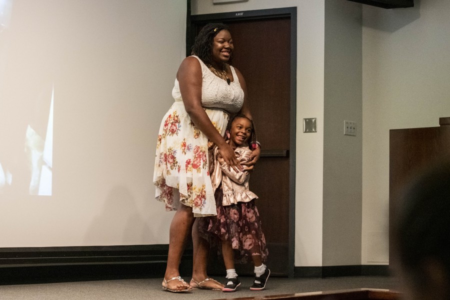 Lynnea storytelling with her daughter before an audience in the Banishing Stigma Room
