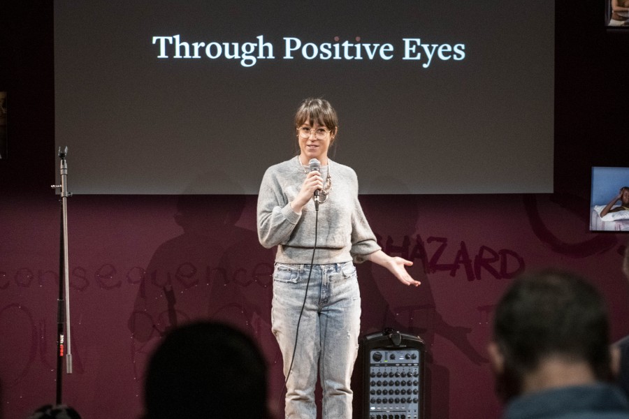 Kelly storytelling before an audience in the Banishing Stigma Room