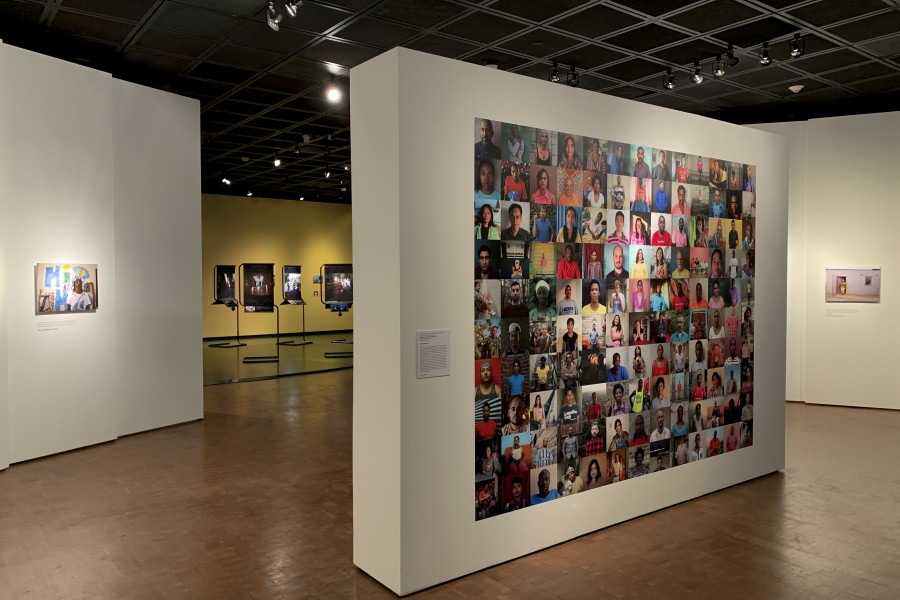 Gideon Mendel’s 122 Faces of Through Positive Eyes at the exhibition entrance