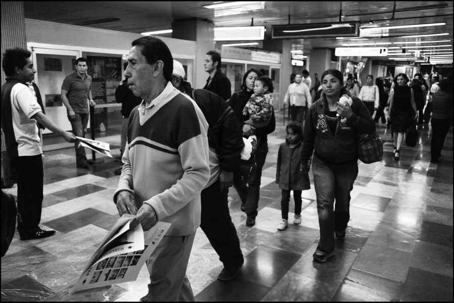 People Walking by the Through Positive Eyes Mexico City Metro Exhibition
